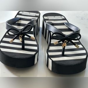 Kate Spade size 9 black and white flip flops.